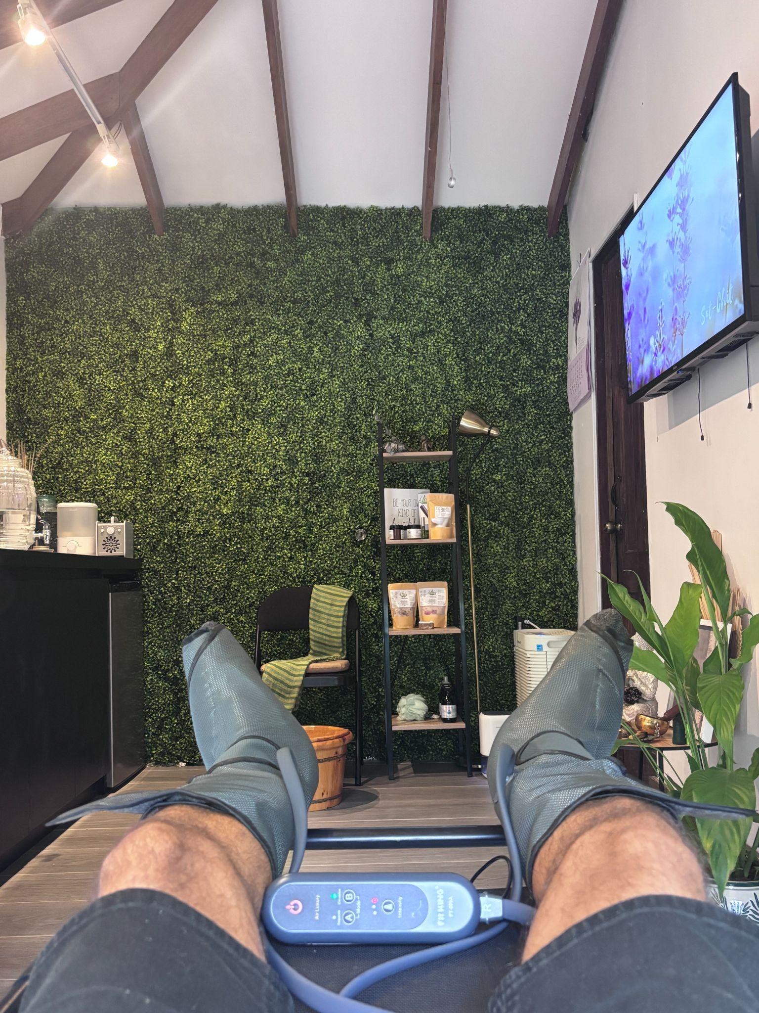 Half-leg pressotherapy garments fitted around the feet and calves